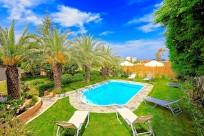 Seasonal outdoor pool, pool umbrellas, pool loungers