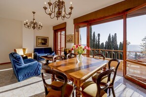 Dining - GuestHost - Cozy penthouse of 110 sqm, able to accommodate up to 4 people, located on the fourth floor of a building with elevator and private garage.The apartment boasts an enchanting view of the sea and Portosole, surrounded by Villa Ormond's and Villa (Sanremo)