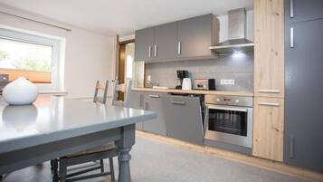 Appartement | Privékeuken | Een kinderstoel