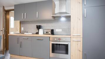 Appartement | Privékeuken | Een kinderstoel