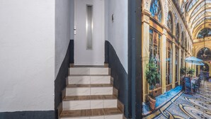 A staircase leading to a room with a view of a building's interior. - Apartment in Kinheim With Lots of Space (Kinheim)
