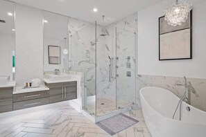 Bathtub, hair dryer, towels, soap