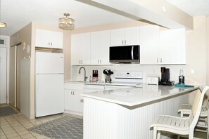 Fridge, microwave, oven, stovetop - Beautiful sunset and ocean view from 2 Bedroom Condo with Free WiFi and an Outdoor Pool Located in Midtown Only Steps to Beach! (Ocean City)