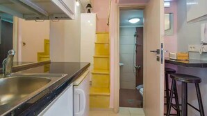 A compact kitchen with a sink, a refrigerator, and a small countertop. - Snug Apartment in Kournas With Balcony/terrace (Apokoronas)