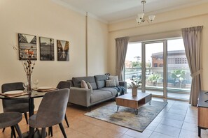 Classic Apartment | Living area | 55-inch Smart TV with cable channels, TV