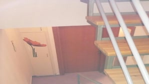 A staircase with wooden steps and metal railings. - Holiday Home in Greece Near the Beach (Preveza)