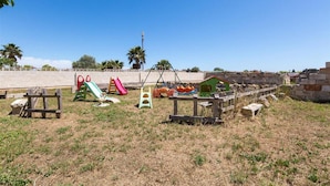 An outdoor playground with various play structures including slides and swings. - 1642 Tenuta Fioravante - Mono Afrodite (Porto Cesareo)