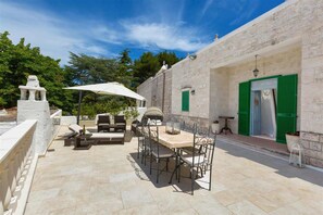 Relax outdoors with a grill and comfortable seating.