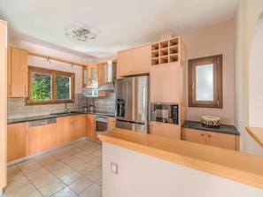 Villa | Private kitchen | Fridge, oven, dishwasher