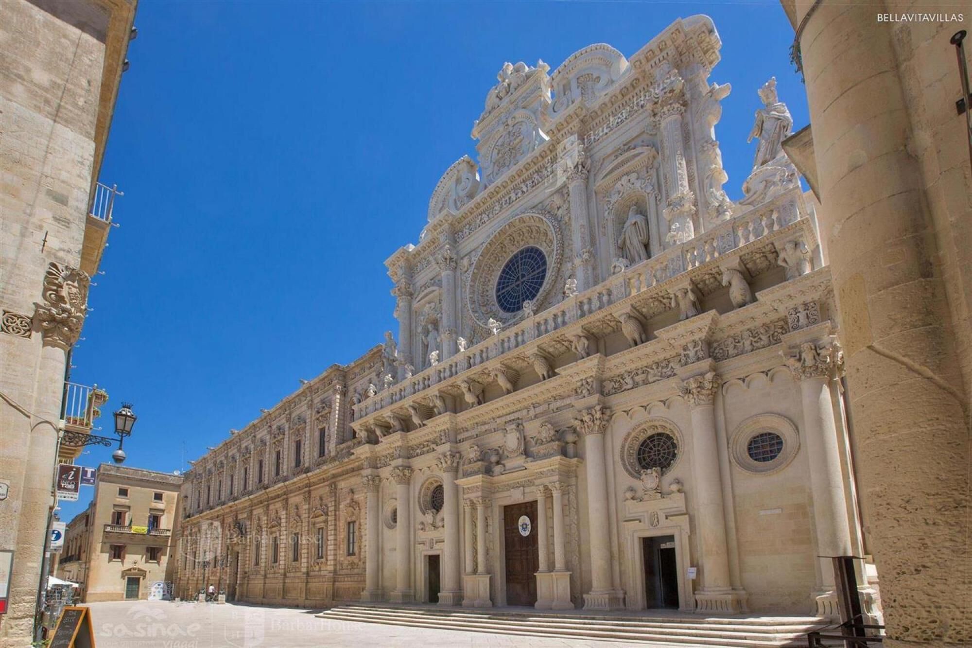 A grand, ornate building with classical architecture, featuring detailed carvings and columns.