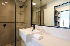 Shower, hair dryer, towels, shampoo