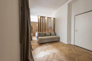 Deluxe Apartment | Living area | 40-inch flat-screen TV with digital channels, TV