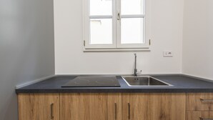 Leilighet – deluxe | Eget kjøkken | Kjøleskap, ovn, kokeplater og kjøkkenutstyr