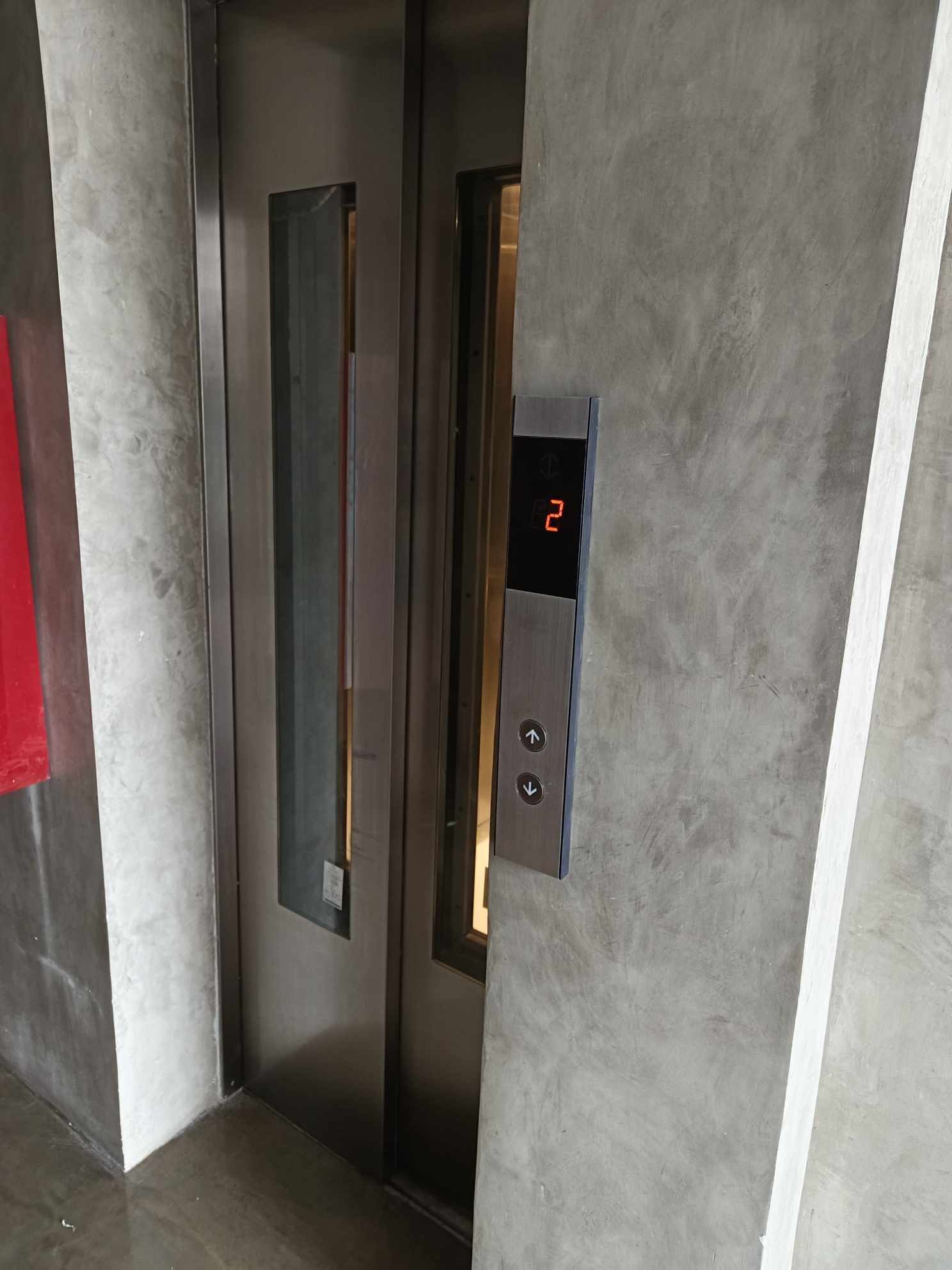 An elevator interior with a digital display showing the number 2.