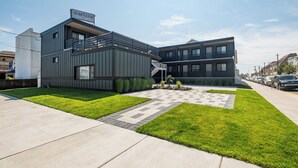 A modern building with a sign reading "SURF CLUB". - The Surf Club (Ocean City)