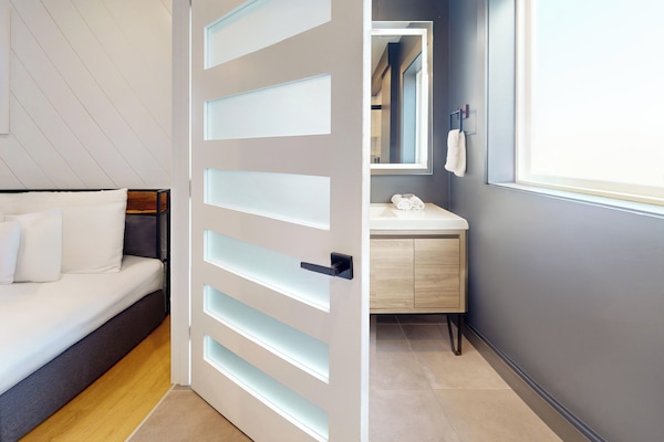 Signature Room, 2 Double Beds | Bathroom | Shower, towels, soap, shampoo