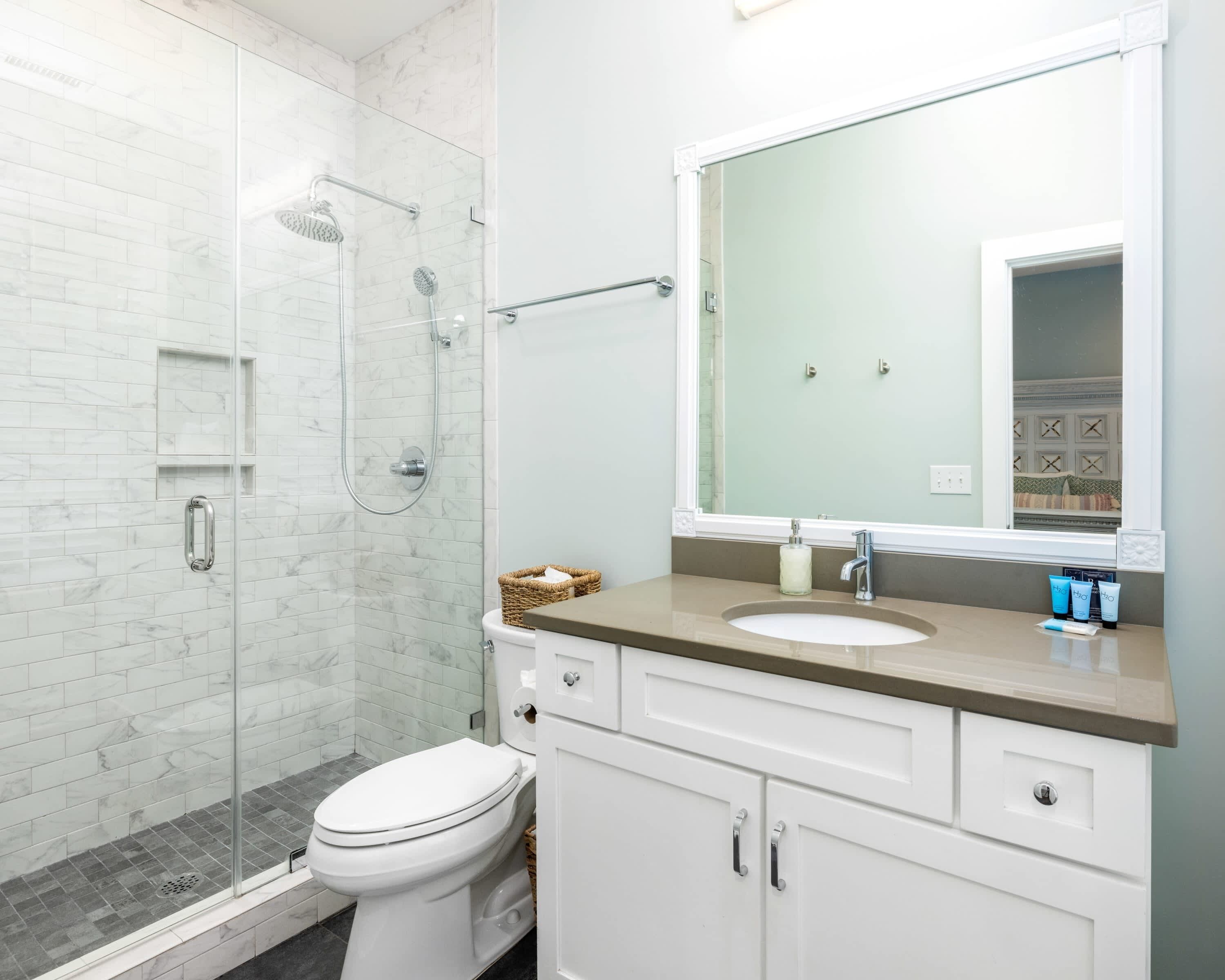 Bathtub, hair dryer, towels, toilet paper
