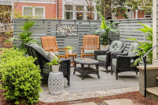 Secluded Courtyard with Wicker Seating and Teak Rockers
