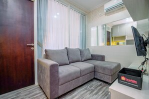 Deluxe Apartment | Living area - Elegant And Comfortable 1Br Apartment At Atlanta Residences (Depok)