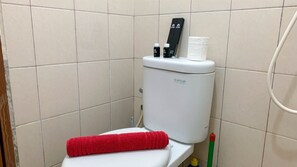 Deluxe Apartment | Bathroom | Shower, towels - Cozy And Tidy Studio At Tifolia Apartment (Jakarta)