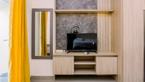 Deluxe Apartment | Living area - Homey And Cozy Living Studio Apartment At B Residence (Pagedangan)