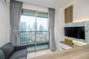 Deluxe Apartment | Living area - Stunning And Cozy 1Br Apartment At Ciputra World 2 (Jakarta)