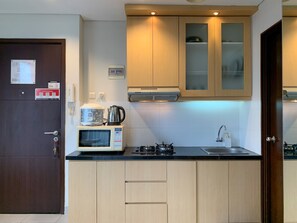 Deluxe Apartment | Private kitchen | Full-size fridge, microwave, stovetop, rice cooker - Nice And Comfort 2Br At 9Th Floor Saveria Bsd City Apartment (Pagedangan)