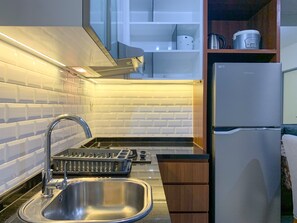 Deluxe Apartment | Private kitchen | Full-size fridge, stovetop, rice cooker, cookware/dishes/utensils - Spacious And Nice 3Br Apartment At M-Town Residence (Gading Serpong)