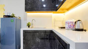 Deluxe Apartment | Private kitchen | Full-sized fridge, stovetop, rice cooker
