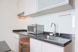 Deluxe Apartment | Private kitchen | Full-size fridge, microwave, stovetop, rice cooker - Nice And Elegant 2Br At 26Th Floor Menteng Park Apartment (Jakarta)