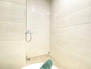 Deluxe Apartment | Bathroom | Shower, towels - Homey Studio Room At Grand Asia Afrika Apartment (Bandung)