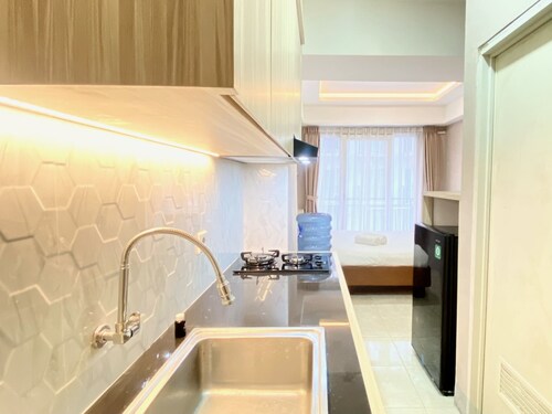 Homey Studio Room At Grand Asia Afrika Apartment