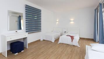 Standard Triple Room | Individually furnished, desk, laptop workspace, blackout curtains