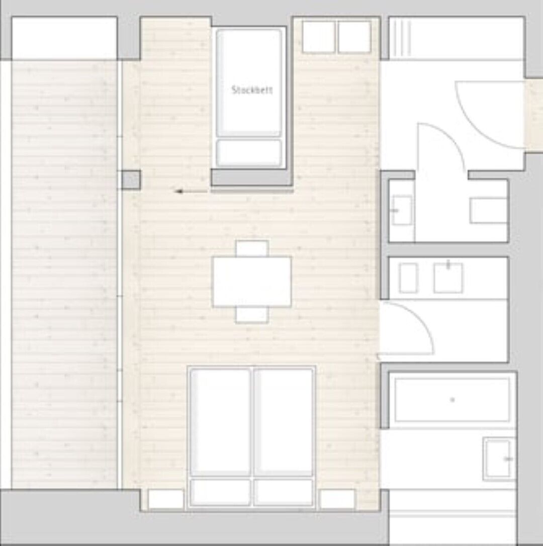 A floor plan with a kitchenette, a dining area, and a bathroom.