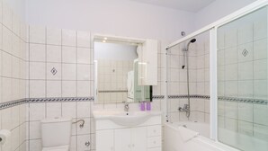 A bathroom with a toilet, sink, and bathtub. - Apartments Bonavista - Premium Two Bedroom Apartment With Balcony and Sea View (Dubrovnik)