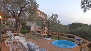 A wooden deck with lounge chairs and a small pool. - Apartments Baldo - Two Bedroom Apartment With Sea View (Dubrovacko Primorje)