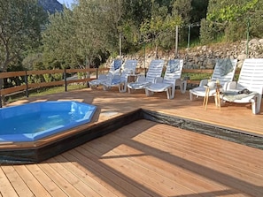 A wooden deck with lounge chairs and a hot tub. - Apartments Baldo - Two Bedroom Apartment With Sea View (Dubrovacko Primorje)