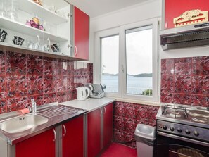 Apartment | Private kitchen | Fridge, microwave, oven, electric kettle - Apartment Giovani - Two Bedroom Apartment With Balcony and Sea View (Dubrovacko Primorje)