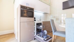 Coffee/tea maker, fridge, microwave, oven