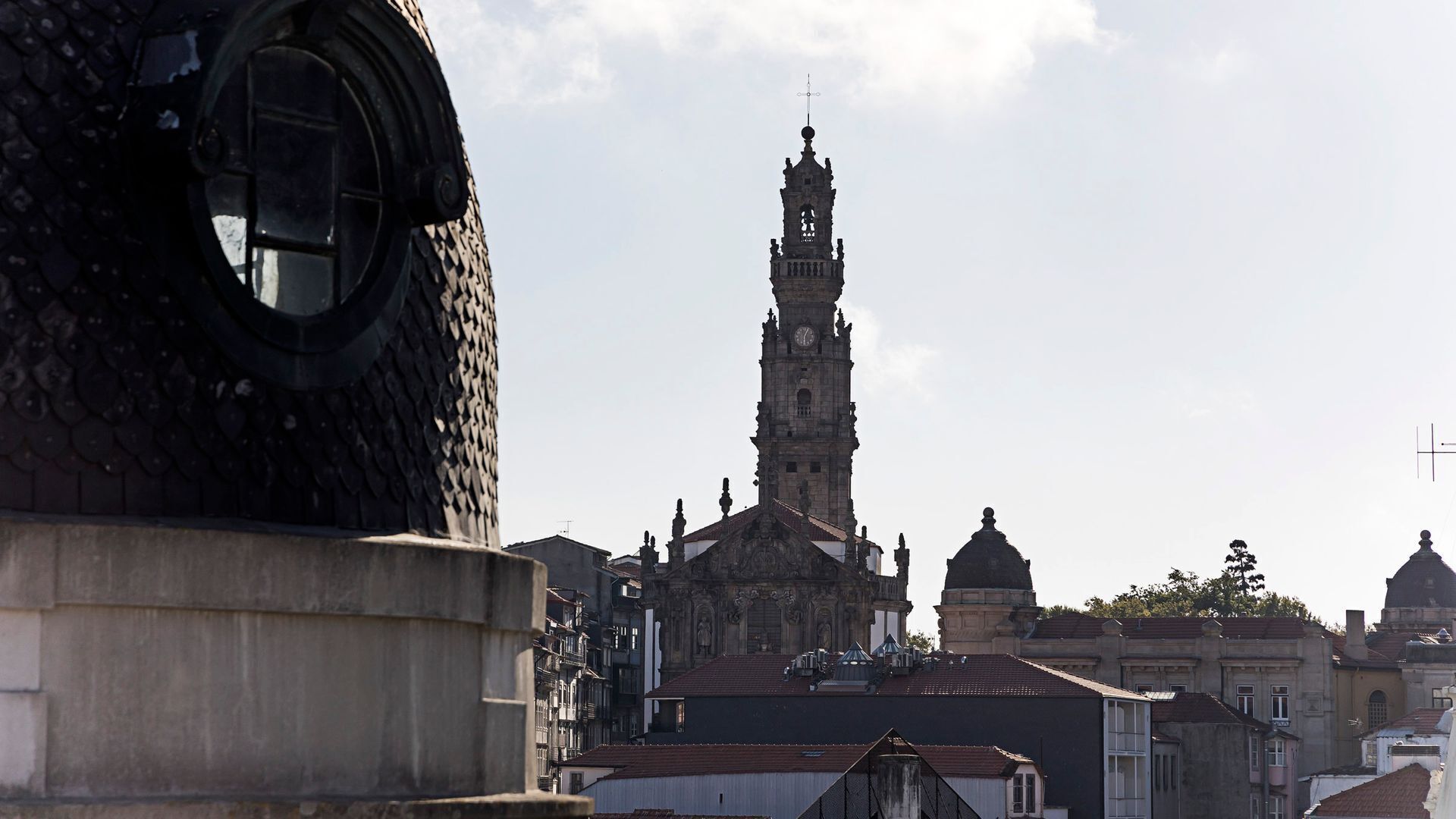 A historic building with a prominent clock tower and ornate architecture.