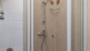 A shower with a handheld showerhead and a wall-mounted control. - Sweetest Thing Apartment - Studio Apartment (Dubrovnik)