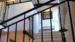 A staircase with black railings leading to an upper floor. - House Rilovic - Two Bedroom House With Swimming Pool and Jacuzzi (Konavle)