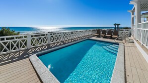 A clear blue pool with a wooden deck and white railings, overlooking a beach and ocean. - Stunning Gulf Front! Private Pool & Beach Access | Inquire for Specials! (Miramar Beach)