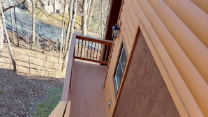 A wooden staircase with black anti-slip strips, leading to a wooden deck area with a railing. - Cozy ski  retreat, close to Appalachian ski mountain in blowing rock and boone  (Blowing Rock)