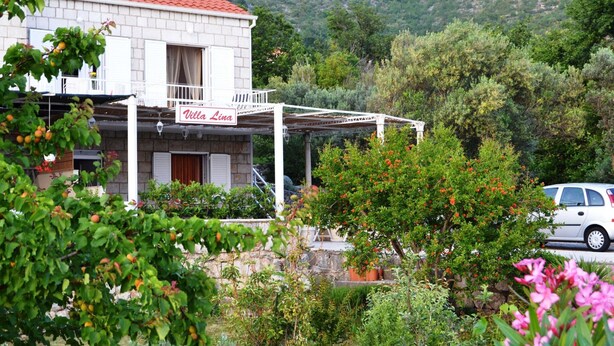 A villa with a red-tiled roof, a covered outdoor seating area, and a sign reading "Villa Lina". - Apartments Lina - Two Bedroom Apartment With Terrace (Dubrovnik)