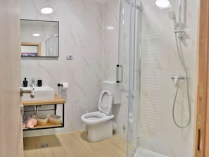 A modern bathroom with a glass-enclosed shower, a white toilet, and a vanity with a mirror. - Fancy Apartments Dream - Deluxe One Bedroom Apartment With Balcony and Sea View (Smokvica)