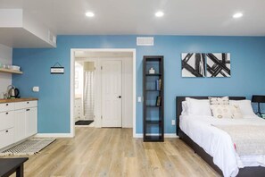 1 bedroom, desk, iron/ironing board, travel crib