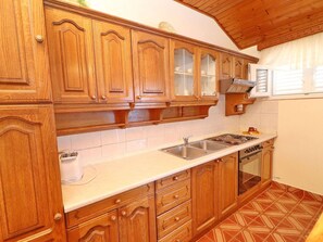Departamento | Cocina privada | Refrigerador, horno y parrilla de estufa 