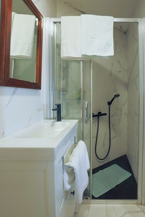 Shower, hair dryer, towels, soap