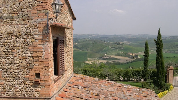 A stone building with a brick roof, a window with shutters, and a view of rolling hills. - Farmhouse in Castelfiorentino With Pool (Castelfiorentino)